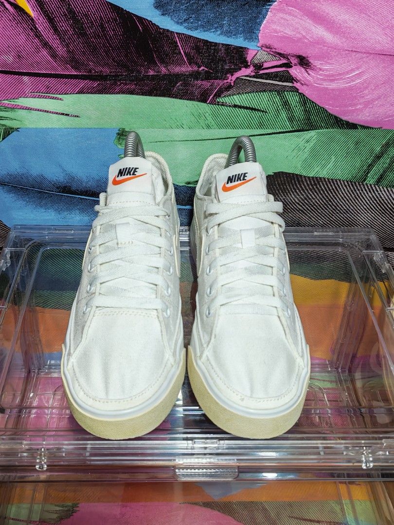 Nike Court Legacy Canvas (Category: Sneakers) located in Dulag. Submitted by konswelosesilyamariya18 (Listing ID 1469608332, Image 3). Description: - Brand: Nike - Model: CZ0294-100 - Style: Low-top canvas sneakers with white leather swoosh & orange tongue branding - Size: US 7 / UK 4.5 / EUR 38 / 24 CM - Details: Rubber toe caps and textured midsoles - Condition: Clean uppers and soles overall - Manufactured: Vietnam (2021).