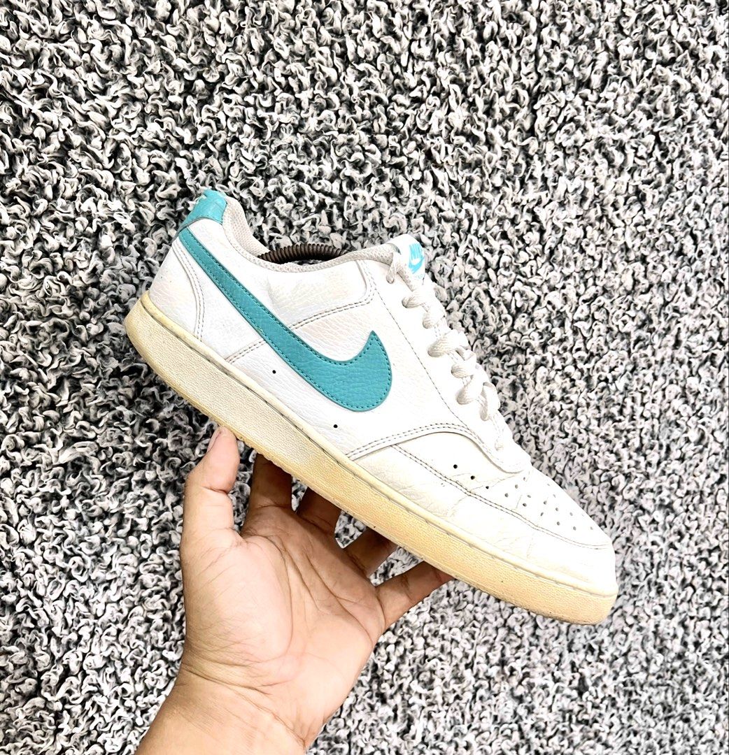 Nike Court Vision Low | Size 44 (Category: Sneakers) located in General Trias. Submitted by zrchustle.604 (Listing ID 1469756600, Image 1). Description: Nike Court Vision Low, featuring a white synthetic leather upper accented by a distinct teal Swoosh logo and heel tab. This classic design takes visual styling inspiration from 1980s retro basketball footwear and features structured stitching, a perforated toe box, and a durable rubber outsole..