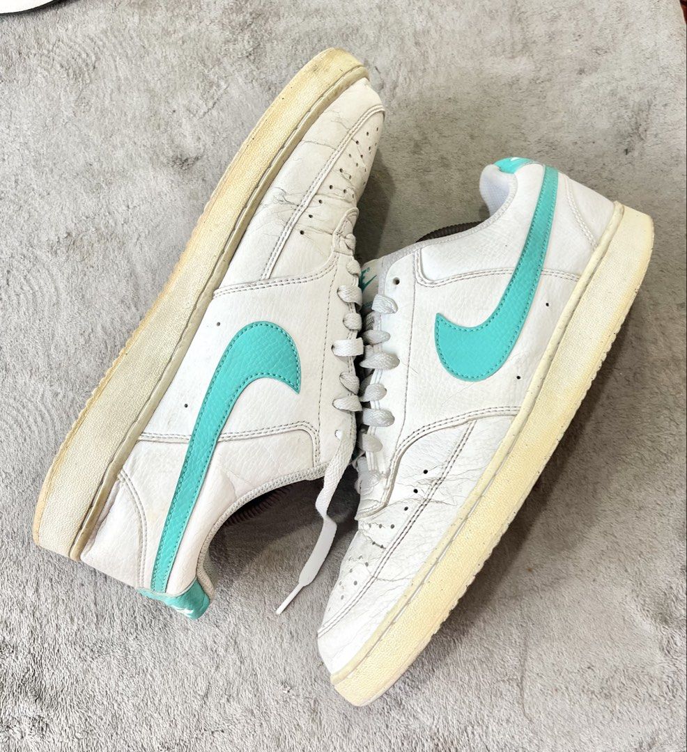 Nike Court Vision Low | Size 44 (Category: Sneakers) located in General Trias. Submitted by zrchustle.604 (Listing ID 1469756600, Image 3). Description: Nike Court Vision Low, featuring a white synthetic leather upper accented by a distinct teal Swoosh logo and heel tab. This classic design takes visual styling inspiration from 1980s retro basketball footwear and features structured stitching, a perforated toe box, and a durable rubber outsole..
