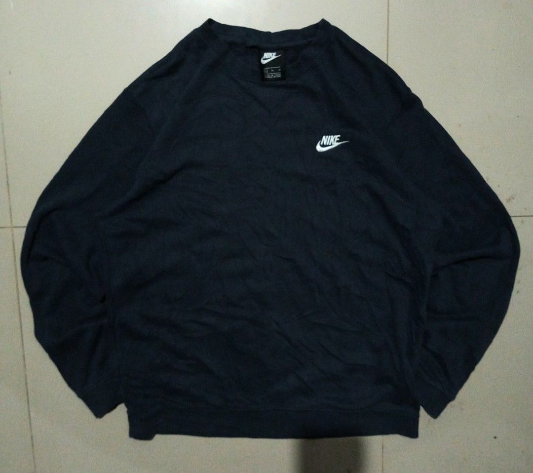 Nike Dark Blue Sweatshirt Size XL (Category: Coats, Jackets and Outerwear) located in Bacolod City. Submitted by richjohn.958 (Listing ID 1469664538, Image 1). Description: - Brand: Nike - Color: Dark Blue - Size: XL - Style: Classic crewneck with small embroidered swoosh logo - Material: Comfortable fleece lining inside - Details: Ribbed collar, cuffs, and hem; made in China - Condition: Clean overall, great for cooler days.