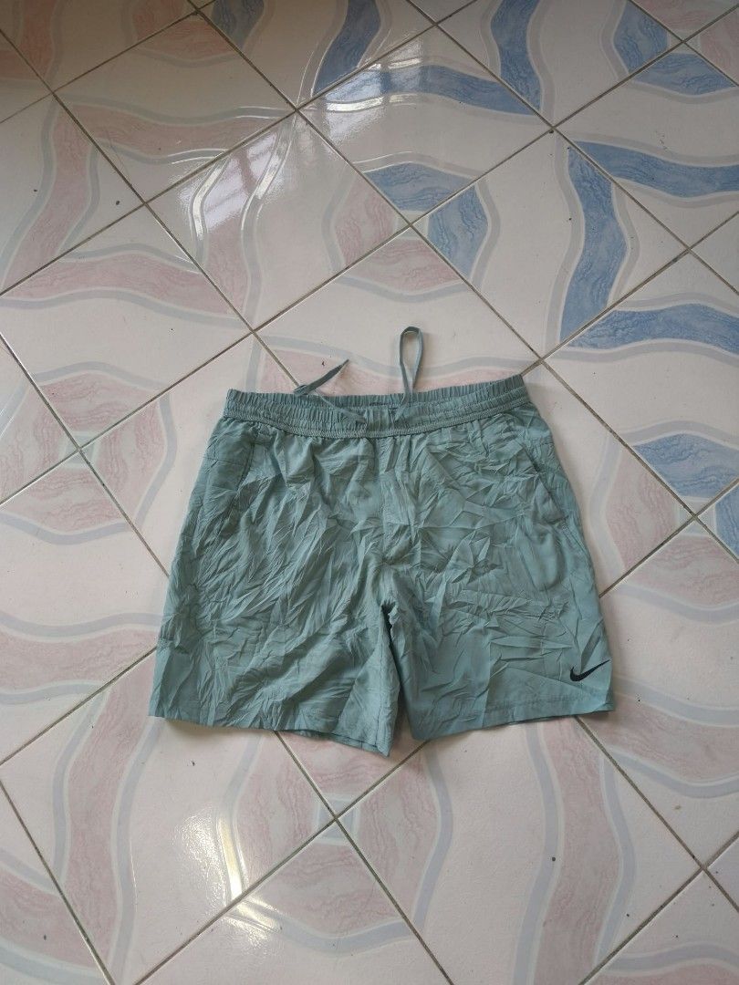 Nike Dri-FIT Sage Green Athletic (Category: Shorts) located in Manila. Submitted by cookthrift (Listing ID 1469574259, Image 2). Description: - Brand: Nike - Color: Sage Green - Size: XL - Technology: Dri-FIT moisture-wicking material - Fit: Elastic waistband with adjustable drawstring - Details: Iconic black Nike swoosh on lower left leg, inner mesh lining - Condition: Brand new / Excellent - Perfect for: Gym workouts, running, and casual wear s