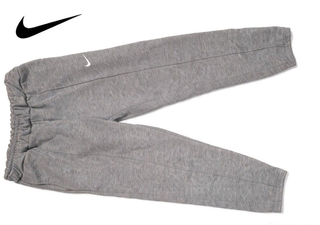 Nike Grey Sweatpants (Category: Joggers) located in Tuguegarao City. Submitted by ZeevLim (Listing ID 1469679149, Image 1). Description: - Brand: Nike - Color: Heather Grey - Design: White embroidered Swoosh on the left leg -size 30 stretch to 31 length 35 - Waistband: Elastic with matching adjustable drawstring - Fabric: Soft, comfortable, and breathable - Condition: Excellent / Like new - Ideal for: Lounging, gym workouts, or casual everyday we