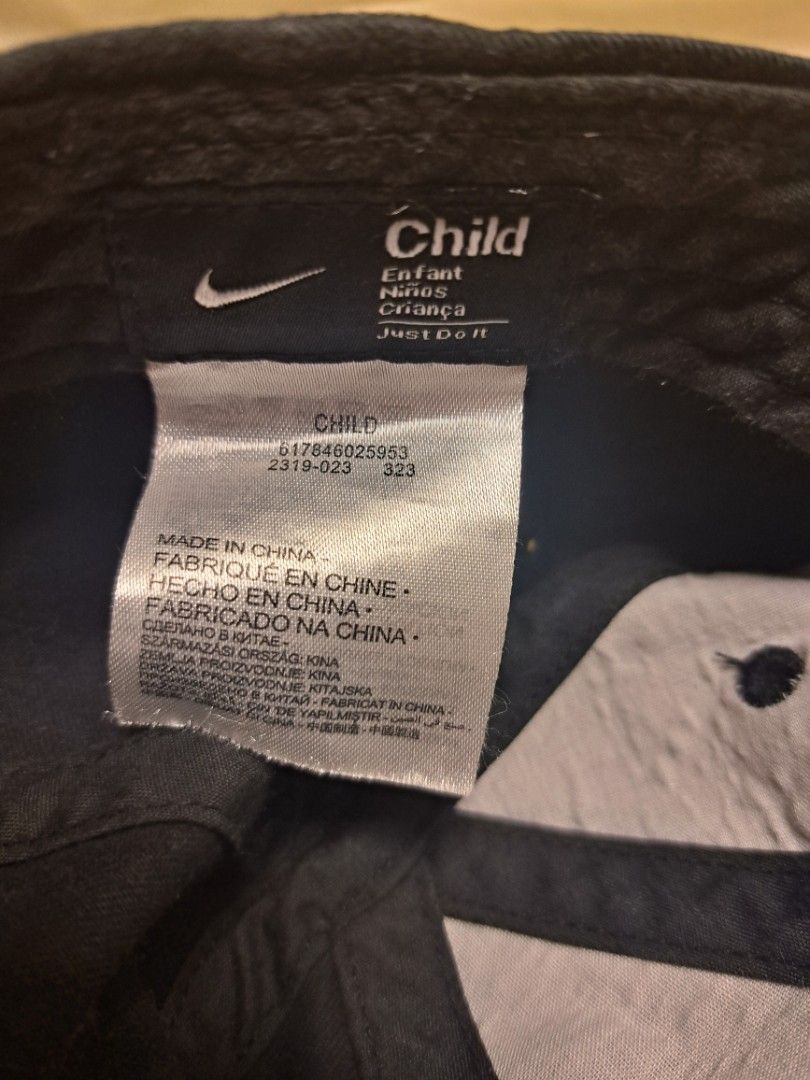 Nike Kids Cap (Category: Kids Wardrobes & Storage) located in Manila. Submitted by sainty.exe (Listing ID 1469694840, Image 2). Description: 7 years old. Model/Style Number: The core identifier on the tag is 617846 (with the full factory production line string showing 617846025953 and style code 2319-023)..