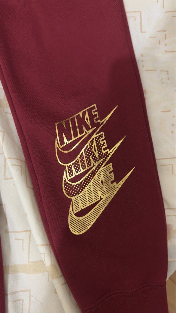 Nike Maroon Gold Logo Sweatpants (Category: Other Bottoms) located in Manila. Submitted by itsmepey (Listing ID 1469728599, Image 2). Description: - unused - unisex.