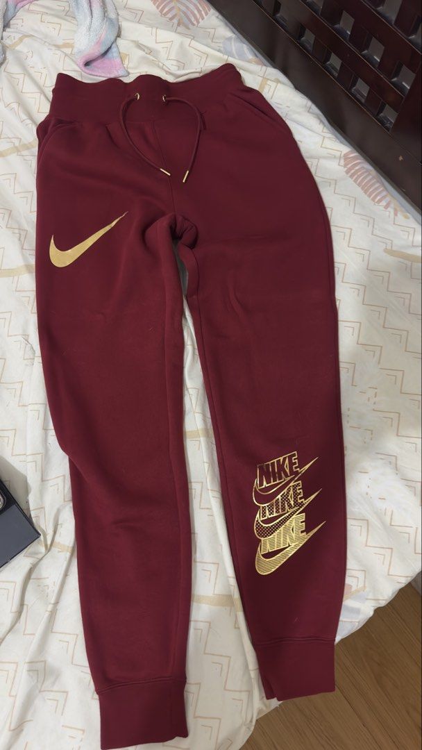 Nike Maroon Gold Logo Sweatpants (Category: Other Bottoms) located in Manila. Submitted by itsmepey (Listing ID 1469728599, Image 1). Description: - unused - unisex.