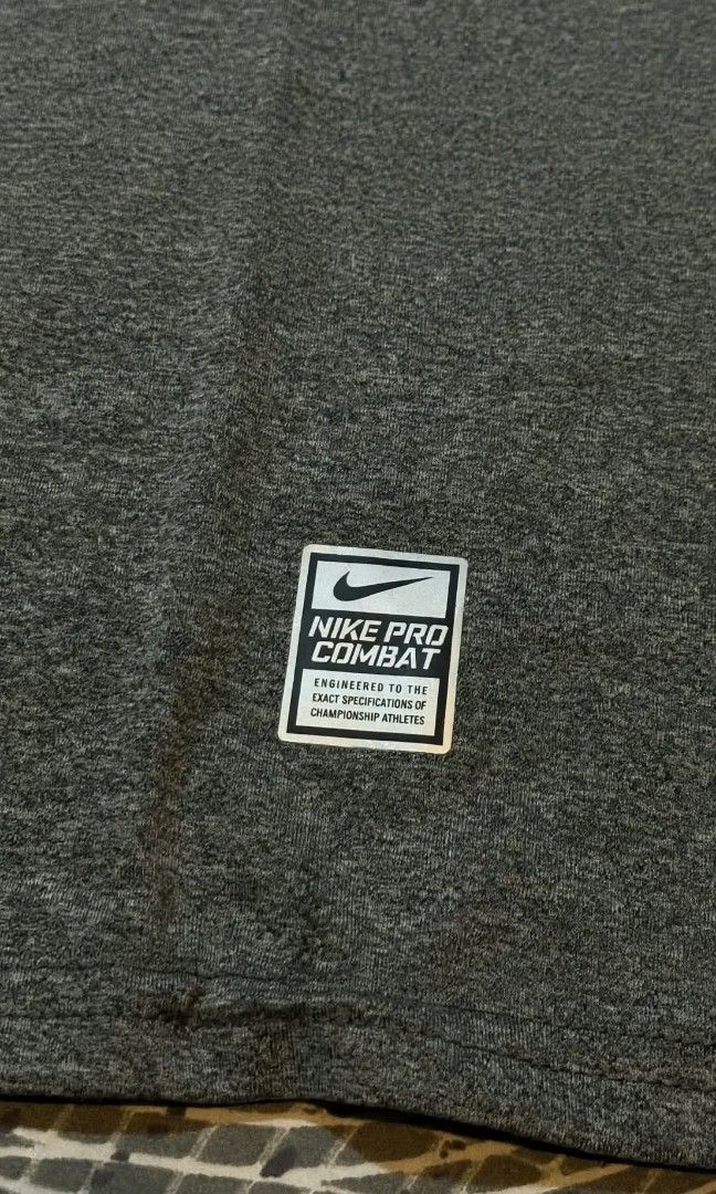 NIKE MID SWOOSH PRO COMBAT (DARK GRAY) (Category: Tshirts & Polo Shirts ) located in Manila. Submitted by jir0findz (Listing ID 1469713557, Image 2). Description: MID SWOOSH PRO COMBAT (DARK GRAY) Width: 19.5 Length: 27 L on tag (stretchable fabric - spandex) DM if interested.