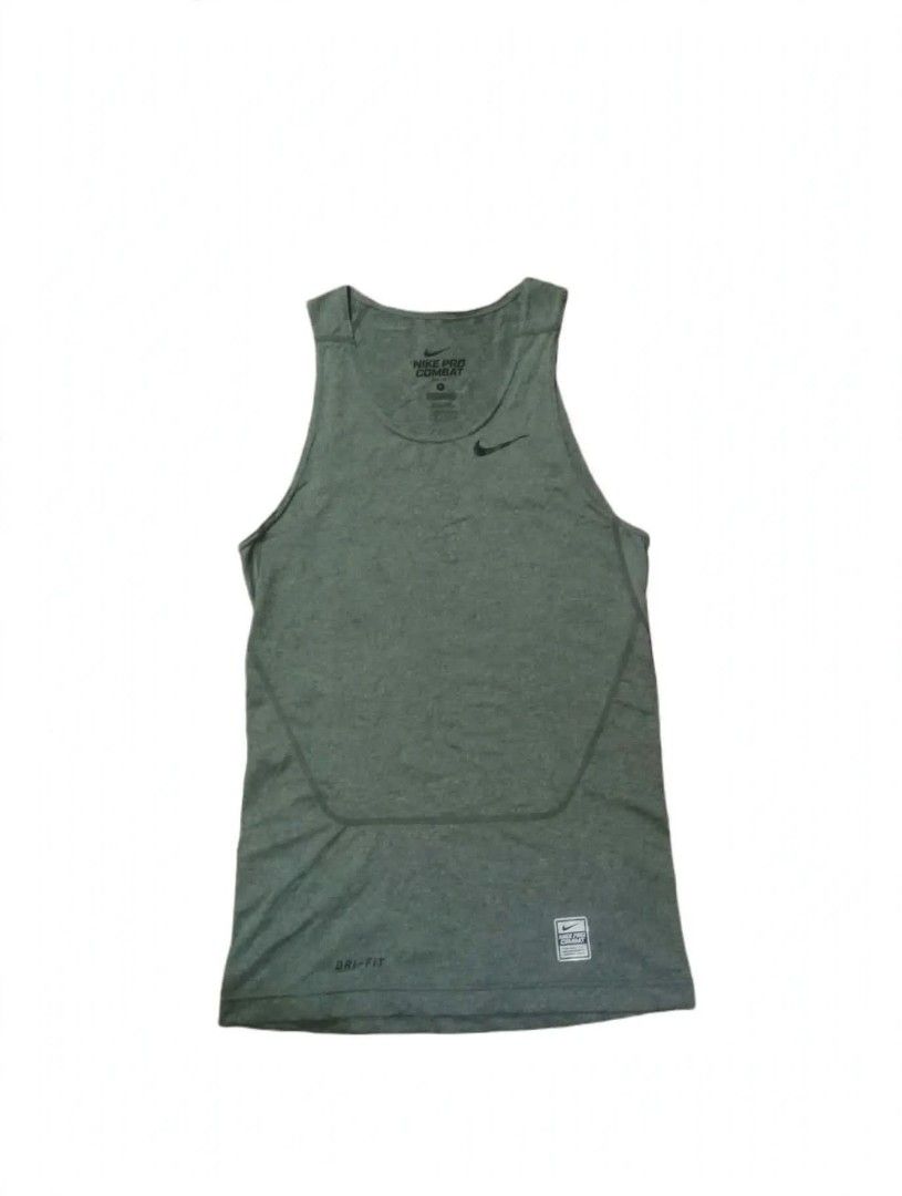 Nike Pro Combat Dri-Fit Grey Tank Top (Category: Activewear) located in Magsaysay. Submitted by giansthrift (Listing ID 1469621519, Image 1). Description: - Authentic grey Nike Pro Combat tank top - Dri-Fit technology keeps you dry and cool during workouts - Classic swoosh logo on the chest and Nike Pro Combat label near the hem - Sleeveless cut with a tight athletic fit - Ideal for the gym, running, or active training - Size tag visible inside t