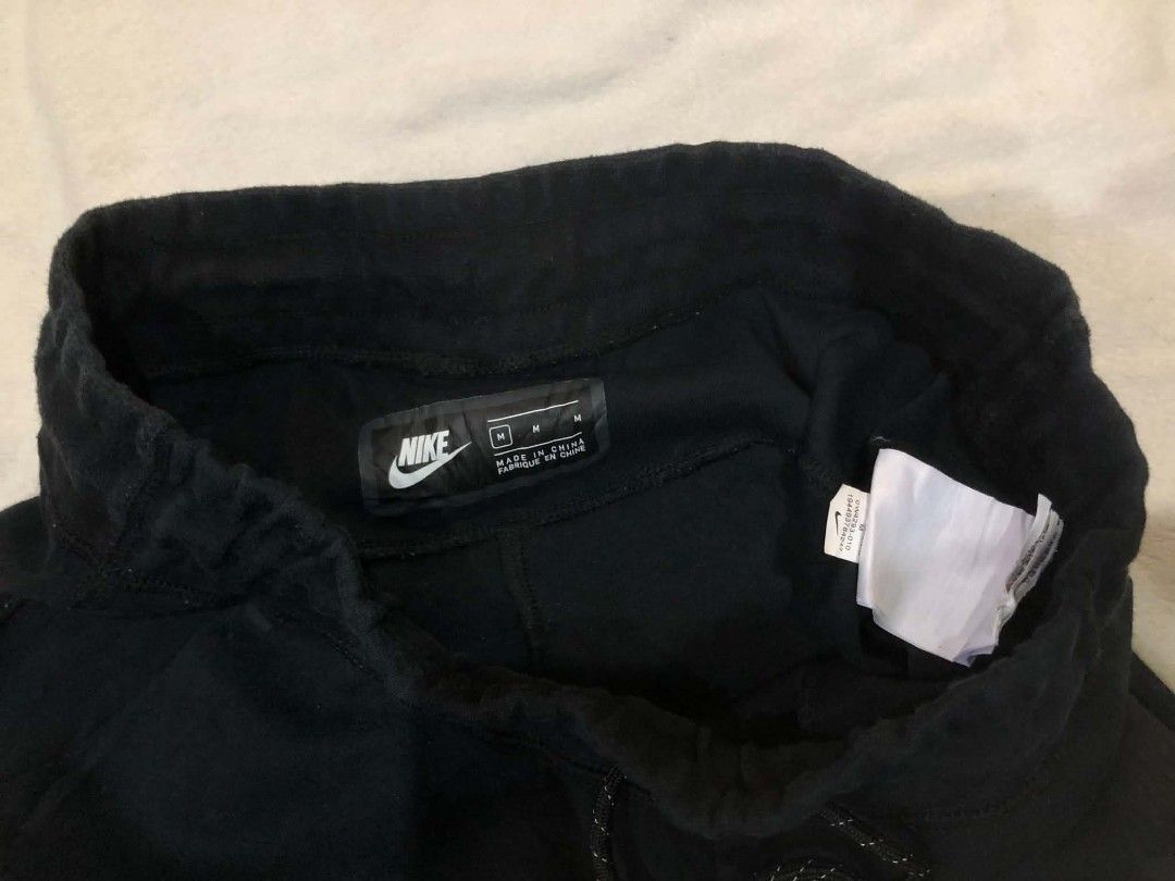 Nike Tech Fleece Joggers Black Size M (Category: Joggers) located in Daet. Submitted by quickearth.ac7e7e (Listing ID 1469697918, Image 3). Description: - Brand: Nike - Model: Tech Fleece Joggers - Color: Black - Size: Medium (M) - Features: Signature zippered pocket on the right leg, adjustable drawstring waistband, and ribbed ankle cuffs - Material: Ultra-soft, warm, and lightweight fleece - Fit: Standard athletic cut - Condition: Brand new / E