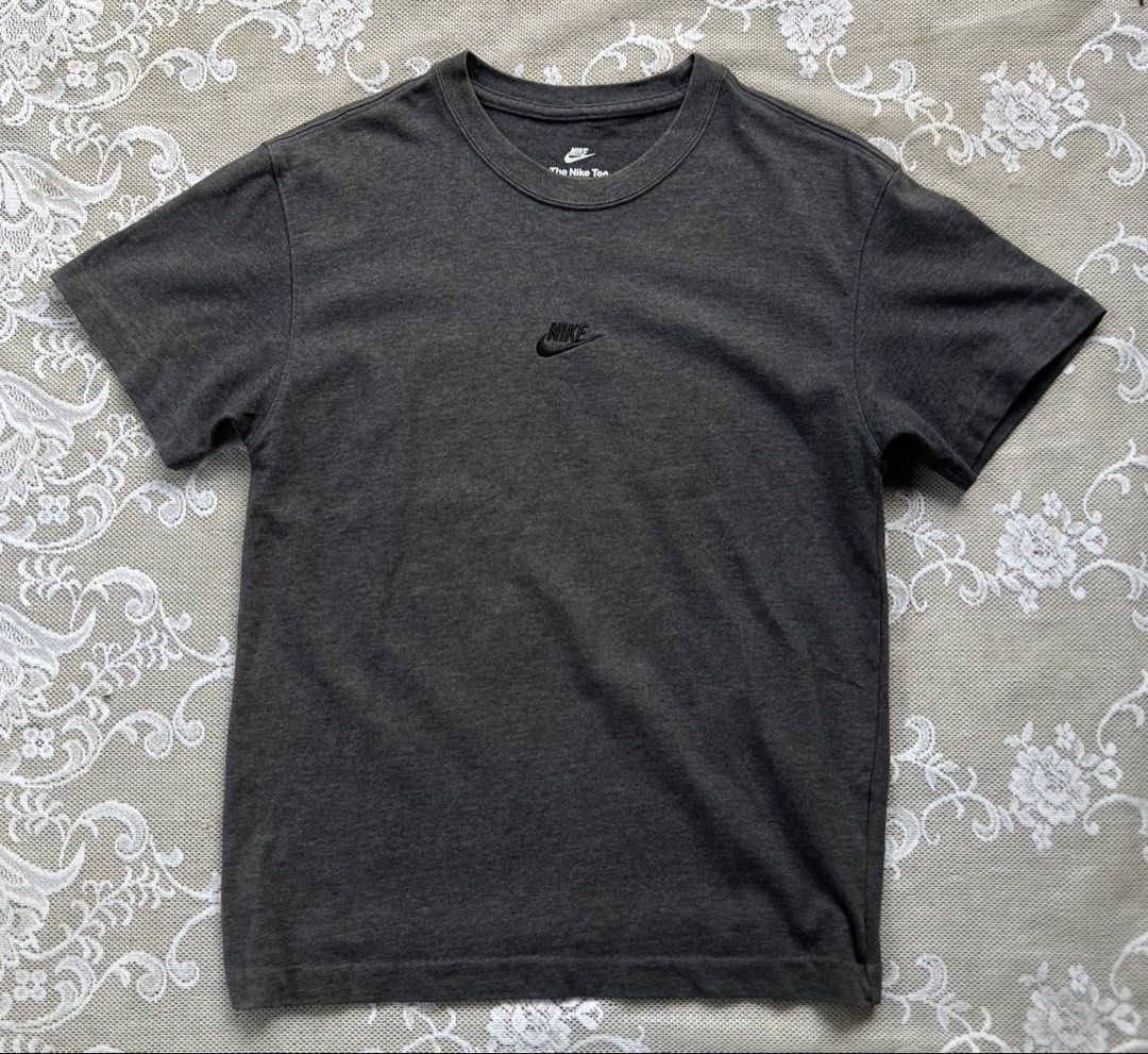 Nike The Nike Tee Dark Grey Embroidered Logo (Category: Tshirts & Polo Shirts ) located in Manila. Submitted by trustedmichael. (Listing ID 1469707083, Image 2). Description: Nike Mid logo grey W 20 L 26 S on tag need wash - Brand: Nike - Color: Dark grey with heathered texture - Size: S (Loose fit) - Design: Small embroidered logo in center chest, classic crew neck, short sleeves - Material: Comfortable cotton - Condition: Clean inside tags and 