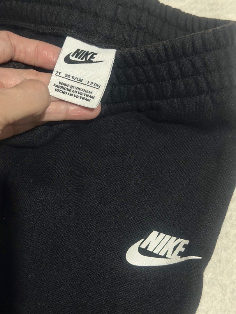 Nike Toddler Black Sweatpants Size 2T (Category: Babies & Kids Fashion) located in Mandaluyong City. Submitted by michgrayb.Enterprise (Listing ID 1469718155, Image 3). Description: Nike sweatpants in classic black. Size 2T, fits toddlers 1 to 2 years old, Elastic waistband and ribbed cuffs at ankles. White Nike logo printed on left thigh. Made in Vietnam. cotton and polyester blend fabric..