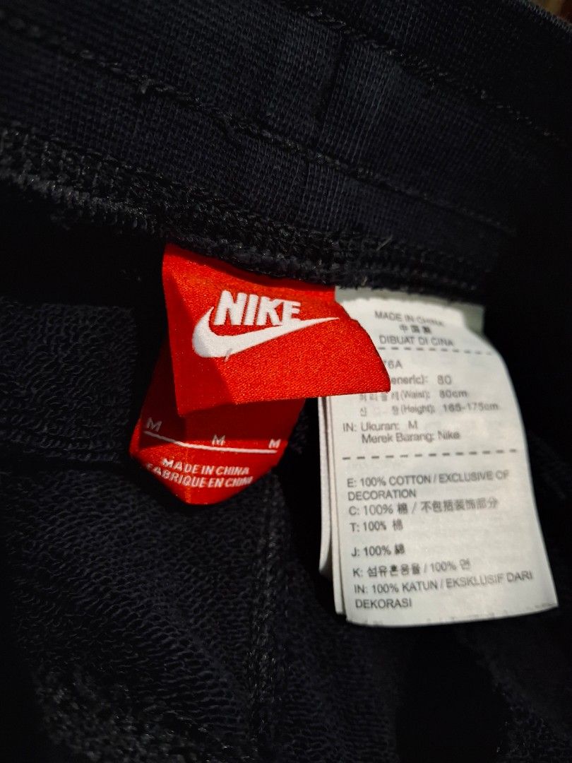 Nike Track & Field Cuff fleece sweatpants (Category: Activewear) located in Cavite. Submitted by adynnej.various.items (Listing ID 1469680552, Image 3). Description: featuring an elastic drawstring waist, side pockets, ribbed ankle cuffs, and a vintage-style Nike Futura logo with "TRACK & FIELD" text on the upper left leg. Have a bit of glitters on the back. W: 30-34, L: 38 Color Rate: 9/10.