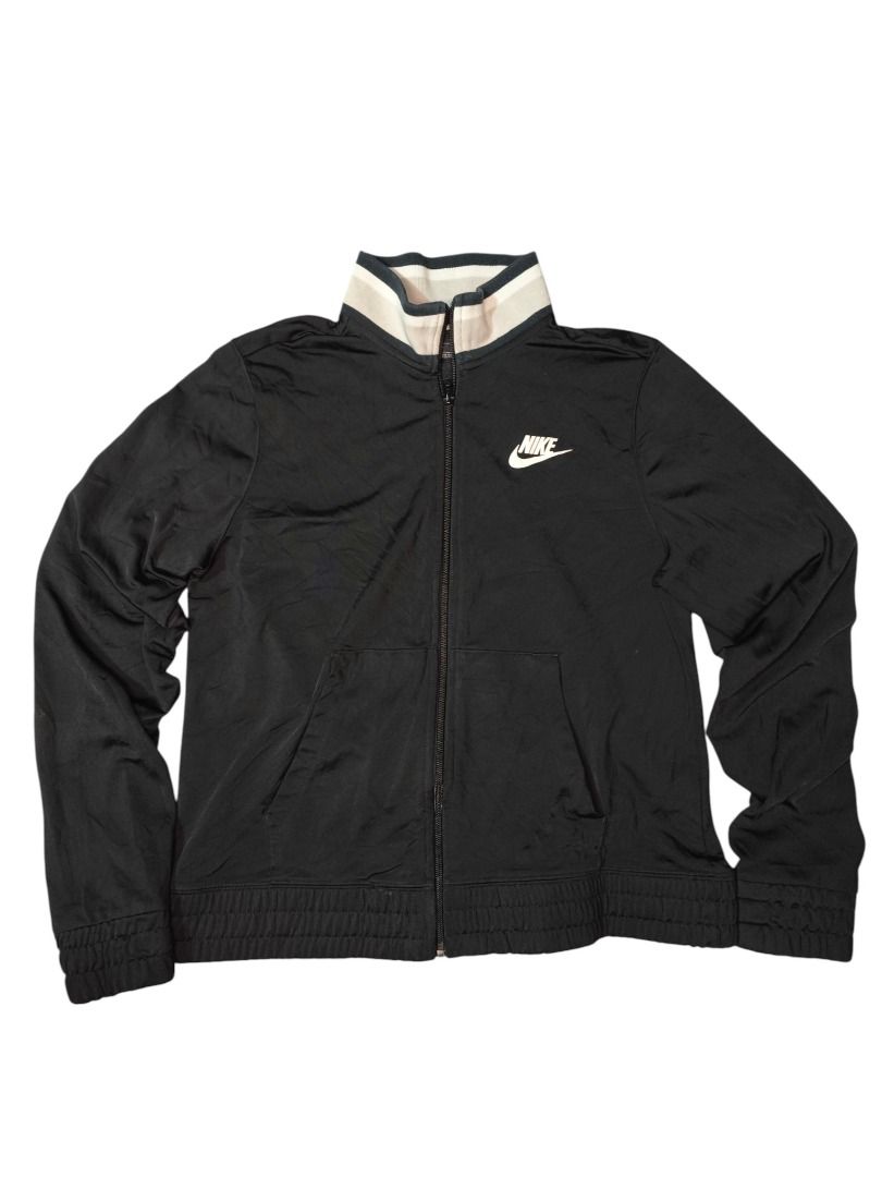 NIKE TRACK JACKET (Category: Activewear) located in Baguio. Submitted by boneteezandharmony (Listing ID 1469664638, Image 1). Description: Classic black Nike zip-up with cream striped collar and embroidered-style swoosh. Clean minimalist sportswear look. Condition: Good Size on tag: M Dimes: Approx. 18” width × 21” length.