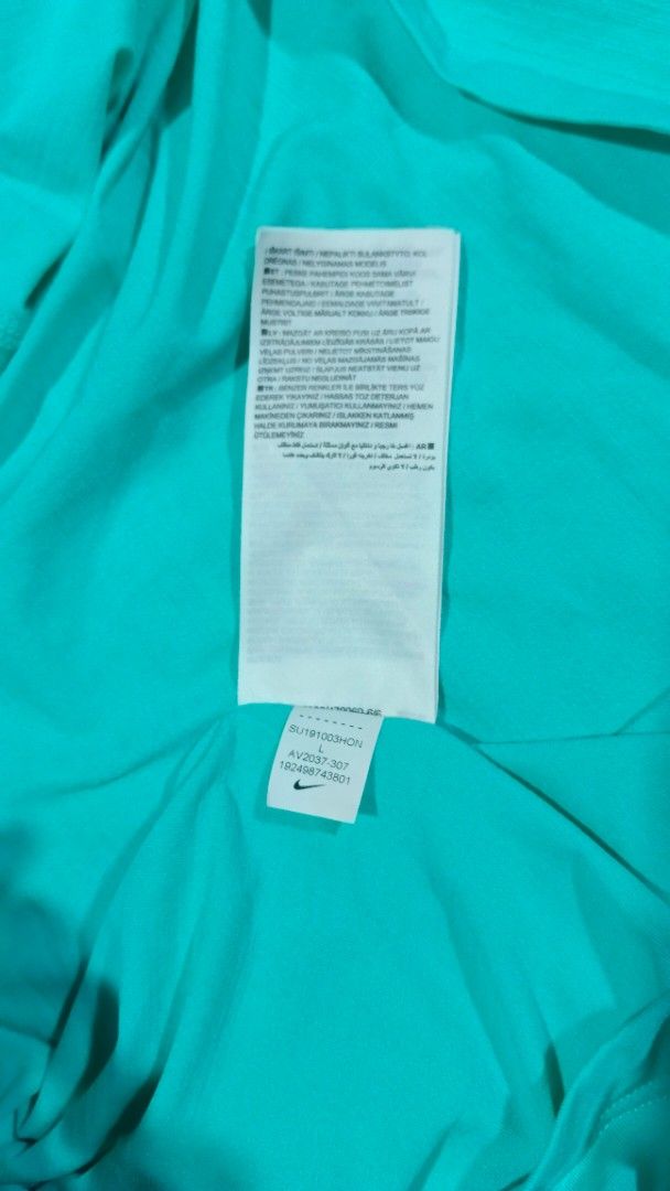 Nike Turquoise Athletic Top Size L (Category: Activewear) located in Cavite. Submitted by navias (Listing ID 1469627581, Image 2). Description: Origin:UAE 100% - Brand: Nike - Size: L - Color: Bright turquoise - Condition: Brand new with tags attached - Origin: Made in Malaysia - Material & Design: Lightweight ribbed fabric with a breathable racerback cutout - Extra Feature: Reflective swoosh logo on the front - Best For: Workouts, running, and c