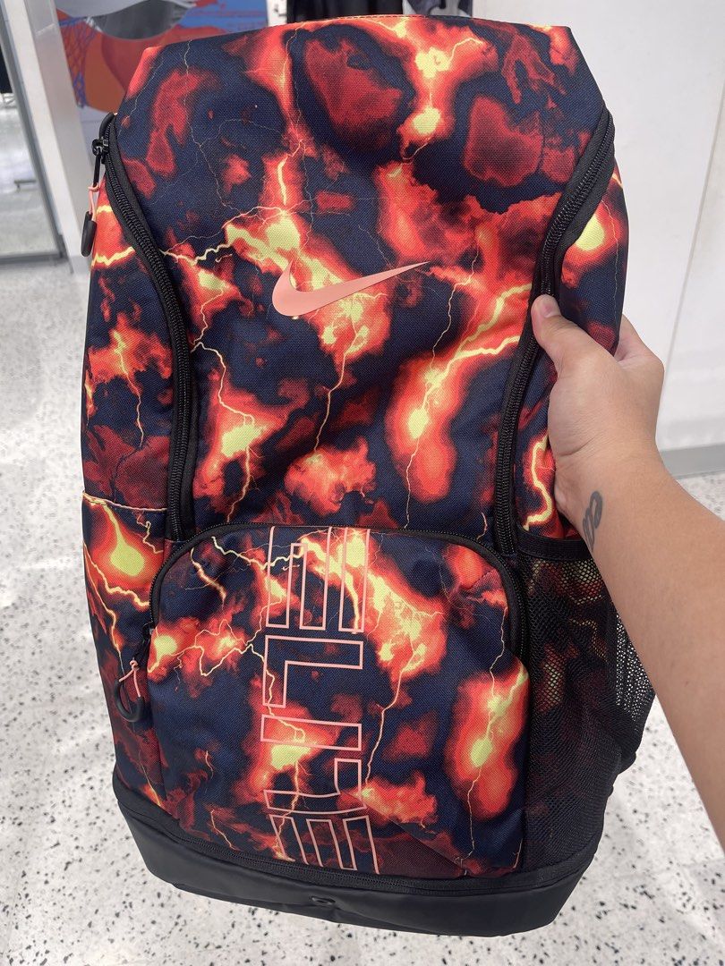 Nike Varsity Elite Basketball Backpack 😍🔥 (Category: Backpacks) located in Manila. Submitted by eapparelsph_ (Listing ID 1469663071, Image 1). Description: - Authentic Nike Varsity Elite backpack in bold red, orange, and black fire lightning design - Features the classic big Nike swoosh and vertical ELITE front branding - Padded shoulder straps equipped with plastic air-vent cushioning for maximum comfort and shock absorption - Spacious main co