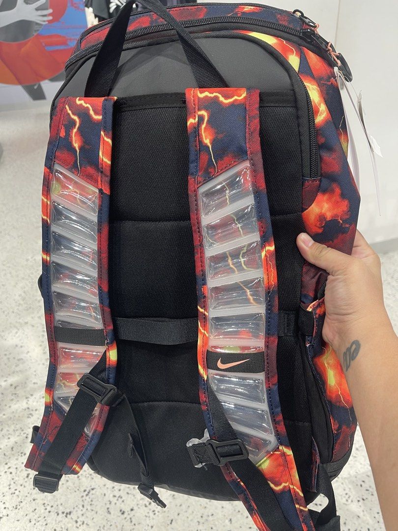Nike Varsity Elite Basketball Backpack 😍🔥 (Category: Backpacks) located in Manila. Submitted by eapparelsph_ (Listing ID 1469663071, Image 2). Description: - Authentic Nike Varsity Elite backpack in bold red, orange, and black fire lightning design - Features the classic big Nike swoosh and vertical ELITE front branding - Padded shoulder straps equipped with plastic air-vent cushioning for maximum comfort and shock absorption - Spacious main co