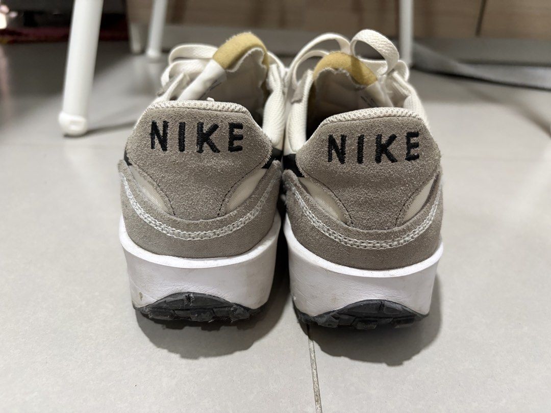 Nike Waffle Nav (Category: Casual Shoes) located in Quezon City. Submitted by shebuys.shebuys (Listing ID 1469611251, Image 1). Description: - Model: Nike Waffle - Colorway: Grey and off-white with a black swoosh - Materials: Premium suede and breathable mesh mix - Details: Trendy exposed foam tongue and classic waffle rubber outsole - Condition: Clean overall look, minimal signs of wear on midsoles and soles Rfs: husband needs more supportive sh