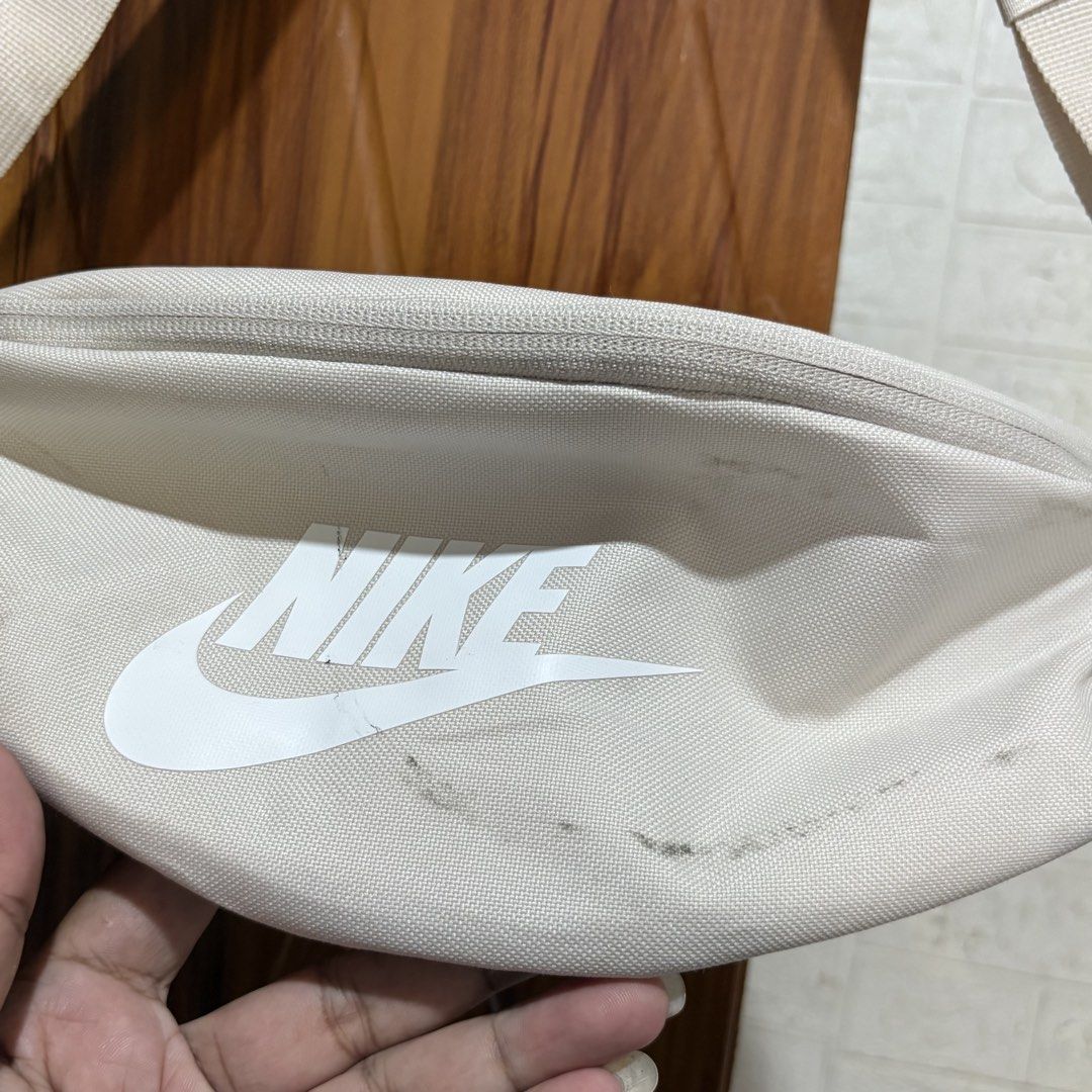 Nike Waist Pack DB0490 104 Off-White (Category: Cross-body Bags) located in Carmen. Submitted by rr_thrifts (Listing ID 1469687057, Image 3). Description: - Brand: Nike - Color: Off-white with large white logo - Style Code: DB0490 104 - Features: Adjustable strap, secure buckle closure, and zippered main compartment - Condition: Good functional condition with original paper hang tags still attached; please note need wash fresh from bale - Perfect