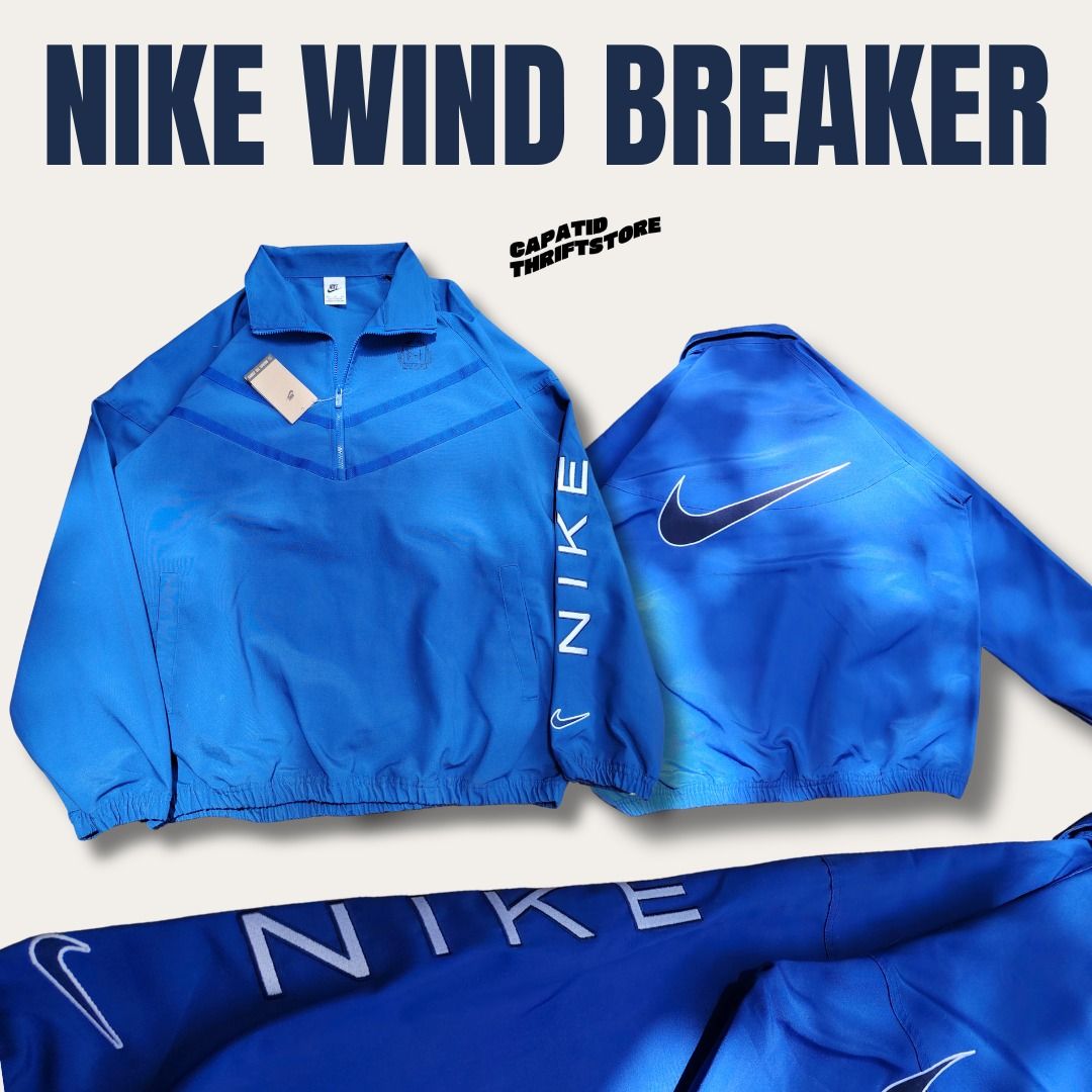 Nike Windbreaker Blue 2XL 100% Cotton (Category: Coats, Jackets and Outerwear) located in Manila. Submitted by capatidthrift (Listing ID 1469586020, Image 3). Description: - Brand: Nike - Condition: Brand new with tags attached - Color: Solid blue with matching zipper - Size: 2XL (Measures 26" pit-to-pit by 30" length) - Material: 100% comfortable cotton - Design Details: Quarter-zip collar, white Nike text print on left sleeve, and large embroid