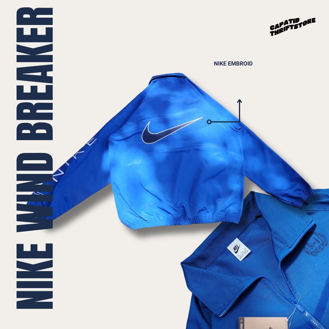 Nike Windbreaker Blue 2XL 100% Cotton (Category: Coats, Jackets and Outerwear) located in Manila. Submitted by capatidthrift (Listing ID 1469586020, Image 2). Description: - Brand: Nike - Condition: Brand new with tags attached - Color: Solid blue with matching zipper - Size: 2XL (Measures 26" pit-to-pit by 30" length) - Material: 100% comfortable cotton - Design Details: Quarter-zip collar, white Nike text print on left sleeve, and large embroid