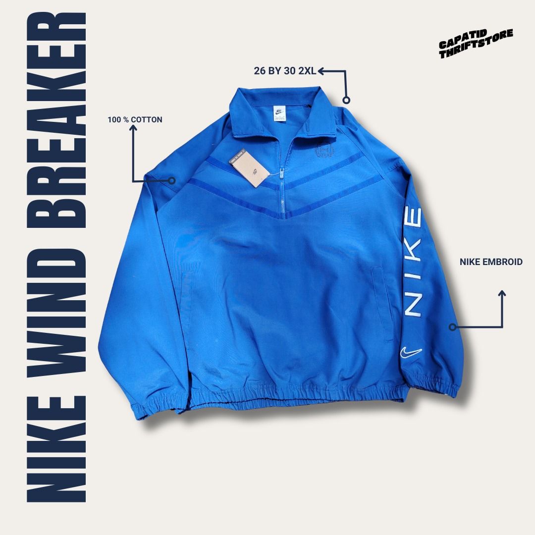 Nike Windbreaker Blue 2XL 100% Cotton (Category: Coats, Jackets and Outerwear) located in Manila. Submitted by capatidthrift (Listing ID 1469586020, Image 1). Description: - Brand: Nike - Condition: Brand new with tags attached - Color: Solid blue with matching zipper - Size: 2XL (Measures 26" pit-to-pit by 30" length) - Material: 100% comfortable cotton - Design Details: Quarter-zip collar, white Nike text print on left sleeve, and large embroid