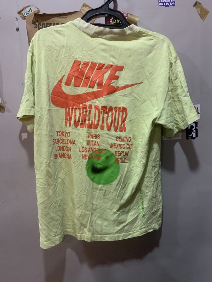 Nike World Tour Lime Green Tee Medium (Category: Tshirts & Polo Shirts ) located in Cagayan de Oro. Submitted by agboysalis60090 (Listing ID 1469742689, Image 2). Description: Light lime green Nike World Tour t-shirt in men's size medium. Double stacked Nike logo embroidered on the chest in orange. Large orange Nike World Tour graphic on the back with multiple city listings printed underneath. 100 percent cotton material. Made in China. Standard 
