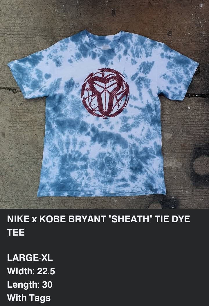 Nike x Kobe Bryant Sheath Tie Dye Tee (Category: Tshirts & Polo Shirts ) located in Cavite. Submitted by josephnl (Listing ID 1469702077, Image 3). Description: - Brand: Nike x Kobe Bryant Collaboration - Design: Blue and white tie-dye wash with maroon Kobe sheath logo on chest - Tag Size: Large-XL (Tagless printed neck label) - Measurements: Width 22.5" / Length 30" - Material: Comfortable cotton - Condition: GOOD.