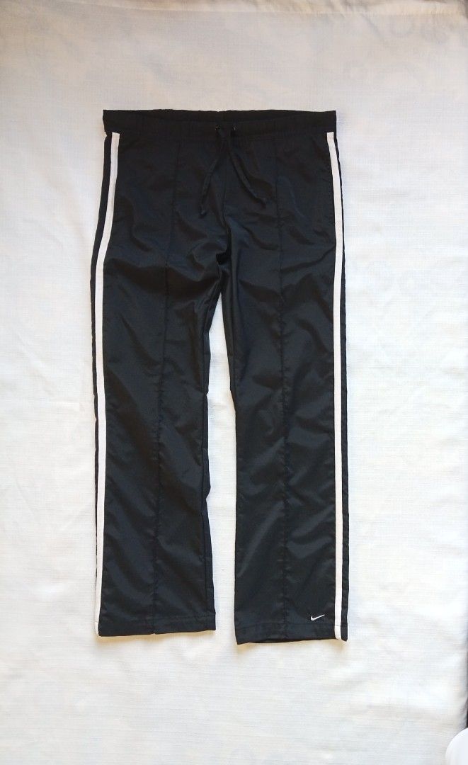 Nike y2k trackpants 2 stripes for her (Category: Activewear) located in Bagabag. Submitted by thrift_stories96 (Listing ID 1469709726, Image 2). Description: Nike y2k trackpants 2 stripes for her Xs on tag fits medium frame Waistline - 28 to 32 Length - 37 Leg opening - 8.5 Condition - 9/10 Color and cloth - 9.5/10 Flaw - fine lints sa upper 2 lines stripe,not noticeable..