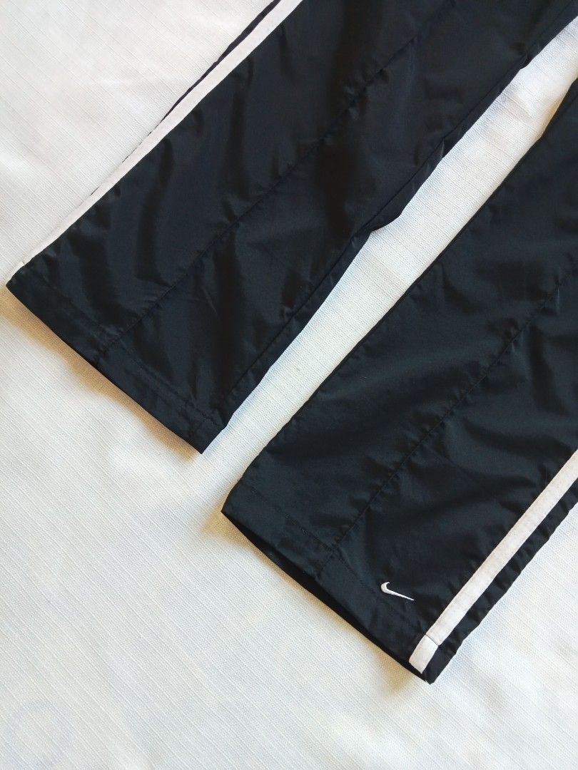 Nike y2k trackpants 2 stripes for her (Category: Activewear) located in Bagabag. Submitted by thrift_stories96 (Listing ID 1469709726, Image 3). Description: Nike y2k trackpants 2 stripes for her Xs on tag fits medium frame Waistline - 28 to 32 Length - 37 Leg opening - 8.5 Condition - 9/10 Color and cloth - 9.5/10 Flaw - fine lints sa upper 2 lines stripe,not noticeable..
