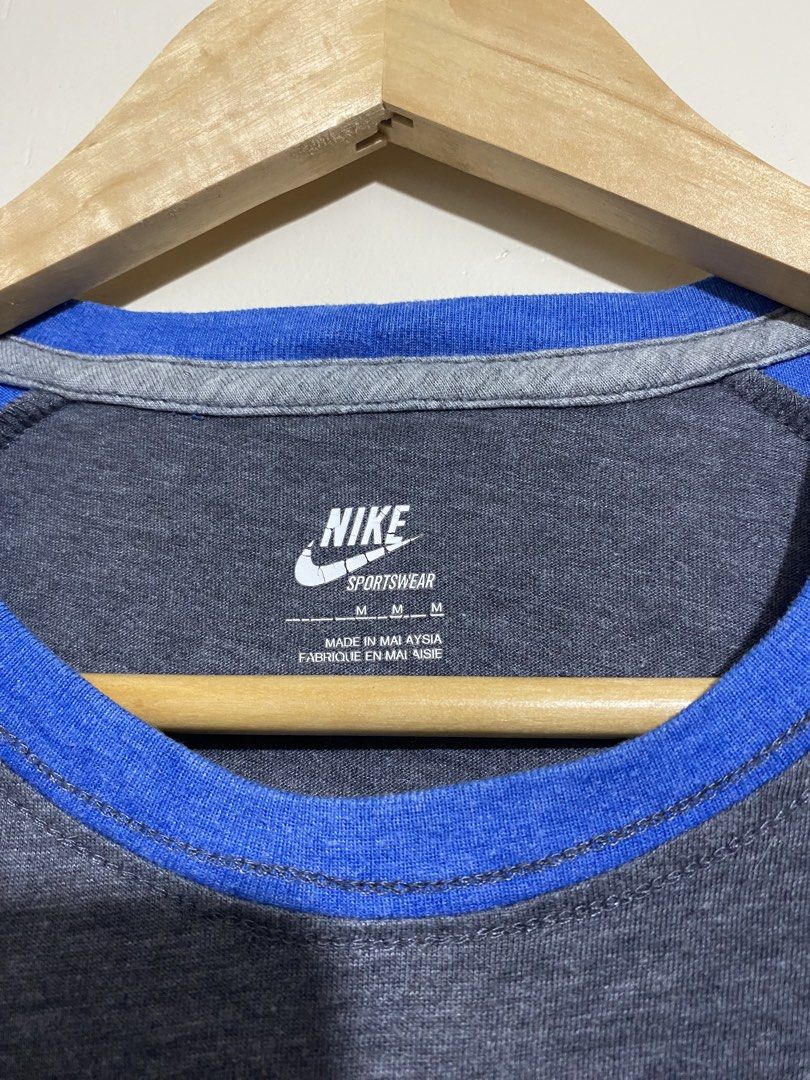 NIKE,T-shirt (Category: Tshirts & Polo Shirts ) located in Cavite. Submitted by jc_thrift95 (Listing ID 1469615621, Image 3). Description: - Nike raglan short-sleeve t-shirt in heather grey with contrasting blue raglan sleeves and a small chest logo. - Made in Malaysia - L- 27 inch - W- 21 inch - Color rate 8/10 - See picture details for dimes..
