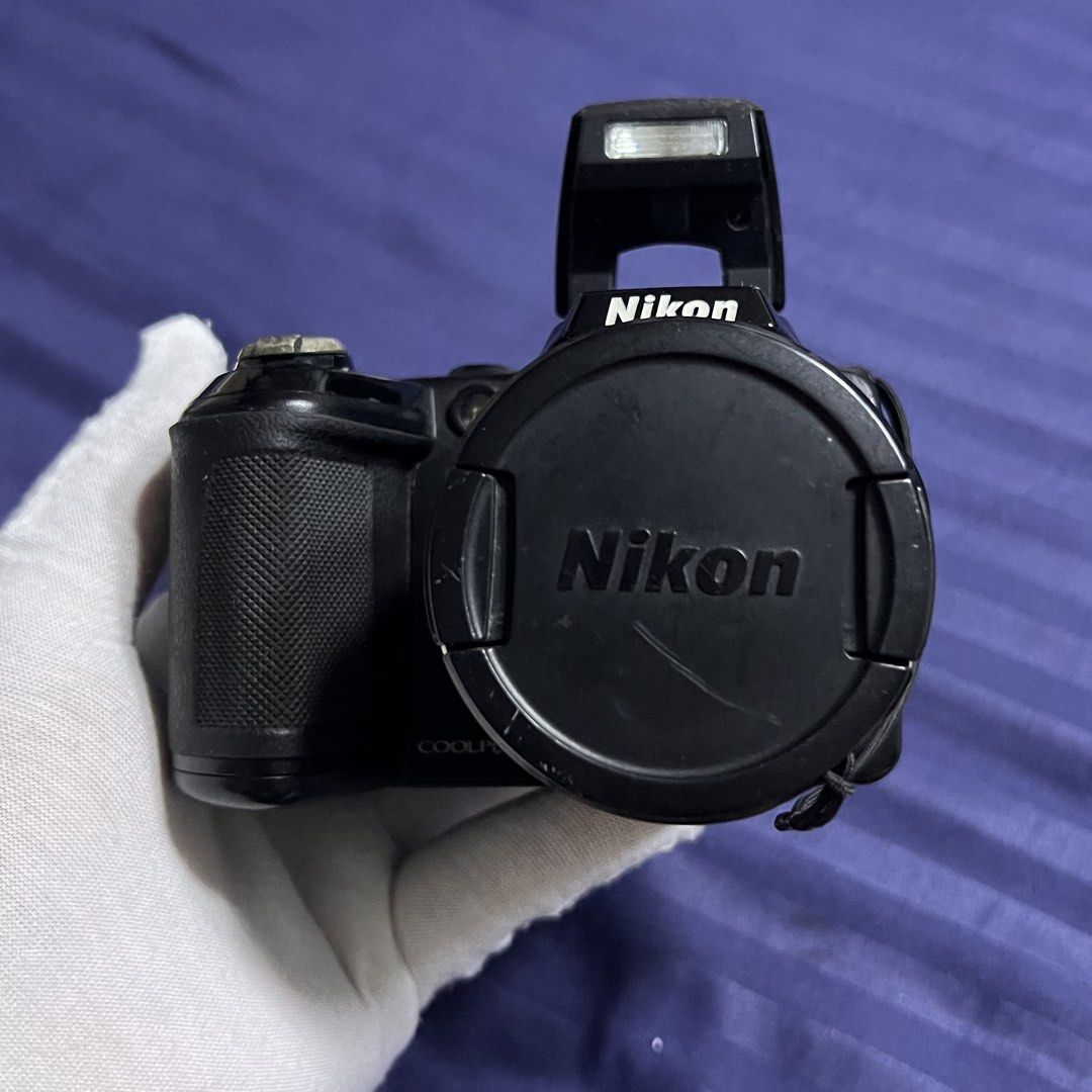 NIKON COOLPIX L120 Digital Camera Digicam (Category: Cameras) located in Makati City. Submitted by patchycakes (Listing ID 1469706266, Image 2). Description: NIKON COOLPIX L120 Digital Camera Body only (no more boxes and wires) Bought in 2011 Working with no issues, tested video and audio - working with no issues Scratches as seen on the picture Comes with its original neck strap No batteries included (uses 4x AA batteries) Suggest you use rechar