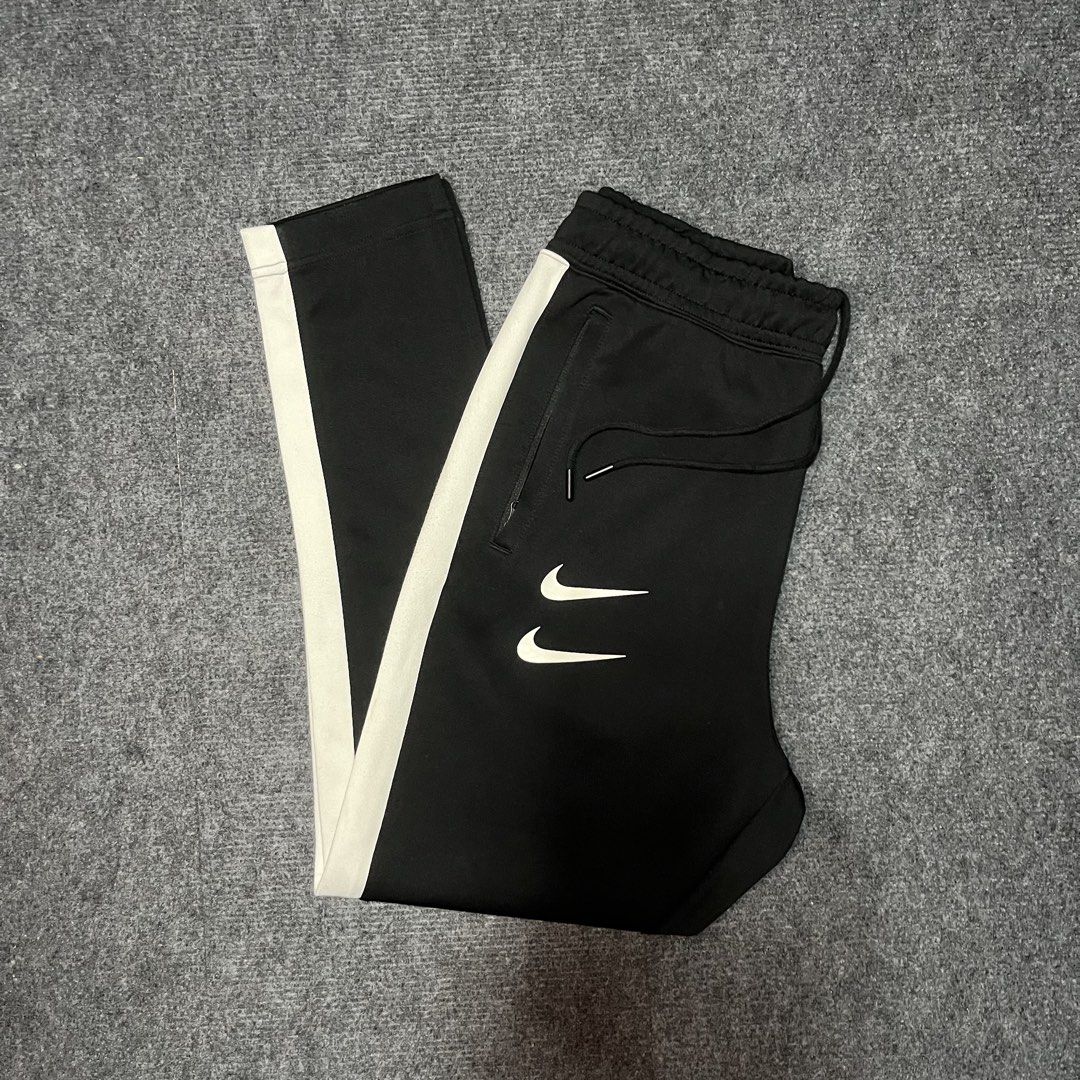 Nile swoosh jogger pants (Category: Joggers) located in Coron. Submitted by tr1p2thr1ft (Listing ID 1469719511, Image 1). Description: Length: 38 10/10 cr and condition No issue .
