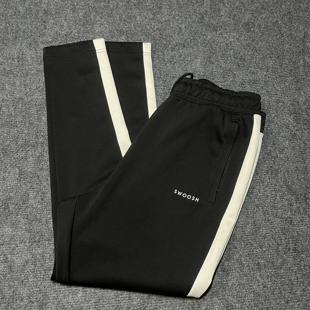 Nile swoosh jogger pants (Category: Joggers) located in Coron. Submitted by tr1p2thr1ft (Listing ID 1469719511, Image 3). Description: Length: 38 10/10 cr and condition No issue .