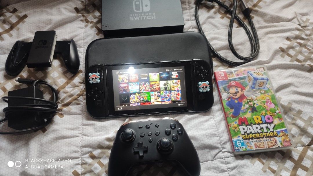 Nintendo Switch Console with Pro Controller and Games Bundle (Category: Nintendo) located in Pasig City. Submitted by manhiehunteru1 (Listing ID 1469757561, Image 1). Description: 10k fix my nitendo switch v1 unpatched 256gb jailbreak 26 games complete acesories no box only free pro controller kingkong at pysical game mario party superstar...plz respect area cainta-pasig pm/dm interested tankz God Bless.