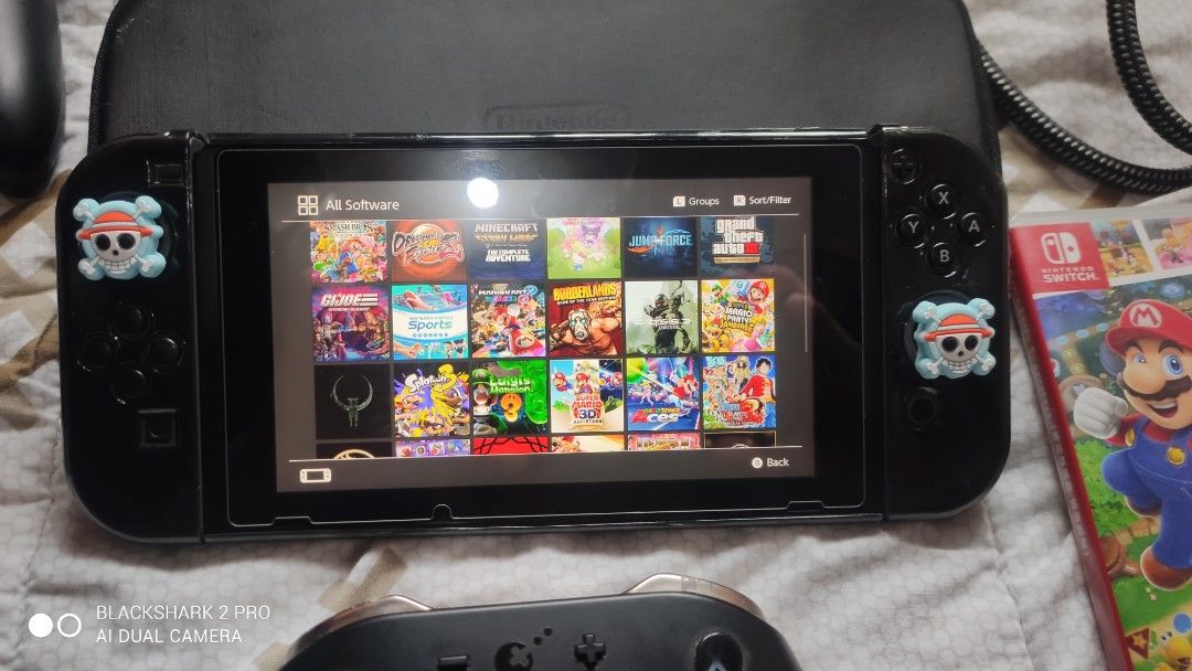Nintendo Switch Console with Pro Controller and Games Bundle (Category: Nintendo) located in Pasig City. Submitted by manhiehunteru1 (Listing ID 1469757561, Image 2). Description: 10k fix my nitendo switch v1 unpatched 256gb jailbreak 26 games complete acesories no box only free pro controller kingkong at pysical game mario party superstar...plz respect area cainta-pasig pm/dm interested tankz God Bless.
