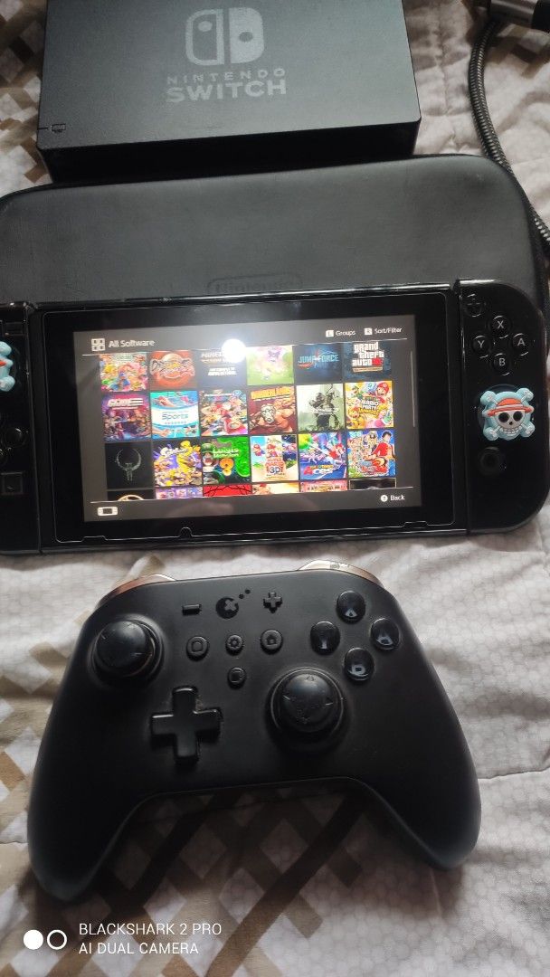 Nintendo Switch Console with Pro Controller and Games Bundle (Category: Nintendo) located in Pasig City. Submitted by manhiehunteru1 (Listing ID 1469757561, Image 3). Description: 10k fix my nitendo switch v1 unpatched 256gb jailbreak 26 games complete acesories no box only free pro controller kingkong at pysical game mario party superstar...plz respect area cainta-pasig pm/dm interested tankz God Bless.