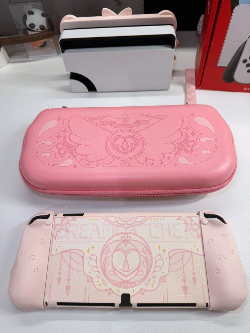Nintendo Switch Oled Complete with geekshare pink cases (Category: Nintendo) located in Makati City. Submitted by Momoring97 (Listing ID 1469731151, Image 3). Description: With casing since day 1 Complete with box ✅ dock ✅ console ✅ hdmi cable ✅ power cable ✅ joycon grip FREE Geekshare accessories ✅ 2 extra joycon grips ✅ joycon staps ✅ case ✅ joycon case ✅ switch bag/case ✅ 4x thumb grips ✅ screen protector ✅ cartilage case All in pristine condi