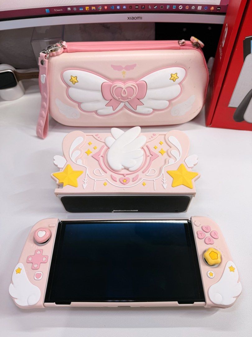 Nintendo Switch Oled Complete with geekshare pink cases (Category: Nintendo) located in Makati City. Submitted by Momoring97 (Listing ID 1469731151, Image 2). Description: With casing since day 1 Complete with box ✅ dock ✅ console ✅ hdmi cable ✅ power cable ✅ joycon grip FREE Geekshare accessories ✅ 2 extra joycon grips ✅ joycon staps ✅ case ✅ joycon case ✅ switch bag/case ✅ 4x thumb grips ✅ screen protector ✅ cartilage case All in pristine condi