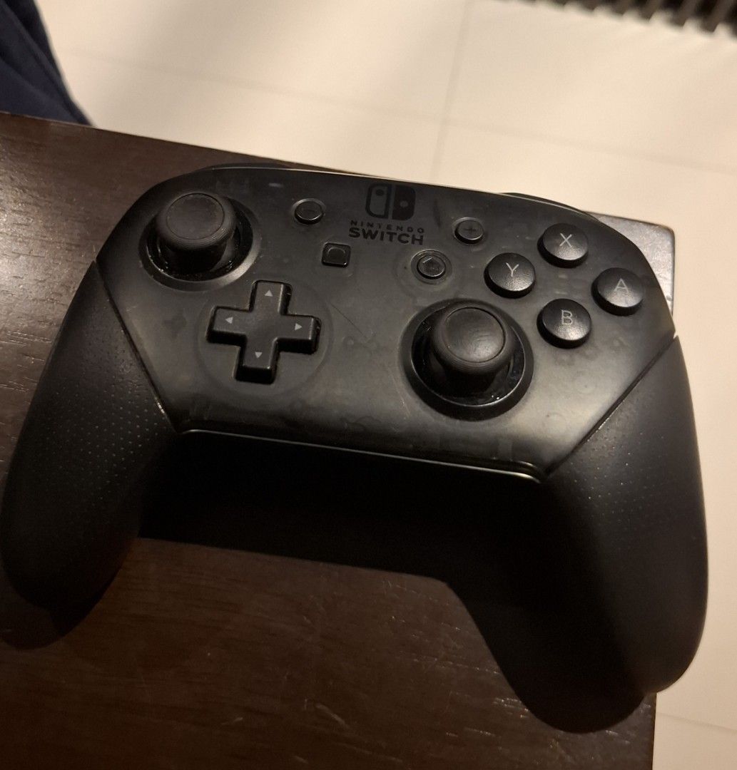 Nintendo Switch Pro Controller (Category: Nintendo) located in Singapore. Submitted by vanillacandle (Listing ID 1469588573, Image 1). Description: - Authentic Nintendo Switch Pro Controller - Ergonomic design for comfortable gameplay thumbsticks slightly degraded from non-usage, can get new covers for a few dollars controller itself excellent working condition, all buttons and joysticks tested (will send video of proof).