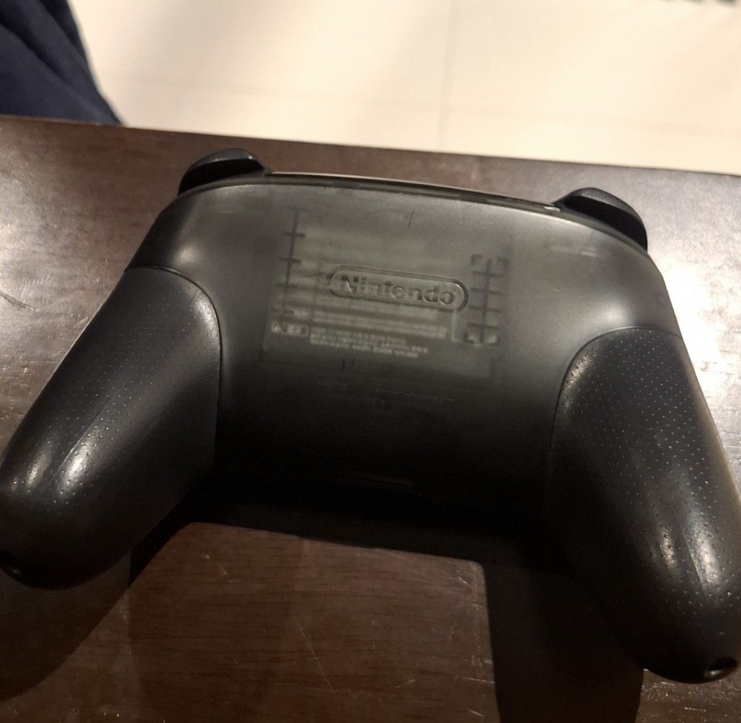 Nintendo Switch Pro Controller (Category: Nintendo) located in Singapore. Submitted by vanillacandle (Listing ID 1469588573, Image 3). Description: - Authentic Nintendo Switch Pro Controller - Ergonomic design for comfortable gameplay thumbsticks slightly degraded from non-usage, can get new covers for a few dollars controller itself excellent working condition, all buttons and joysticks tested (will send video of proof).