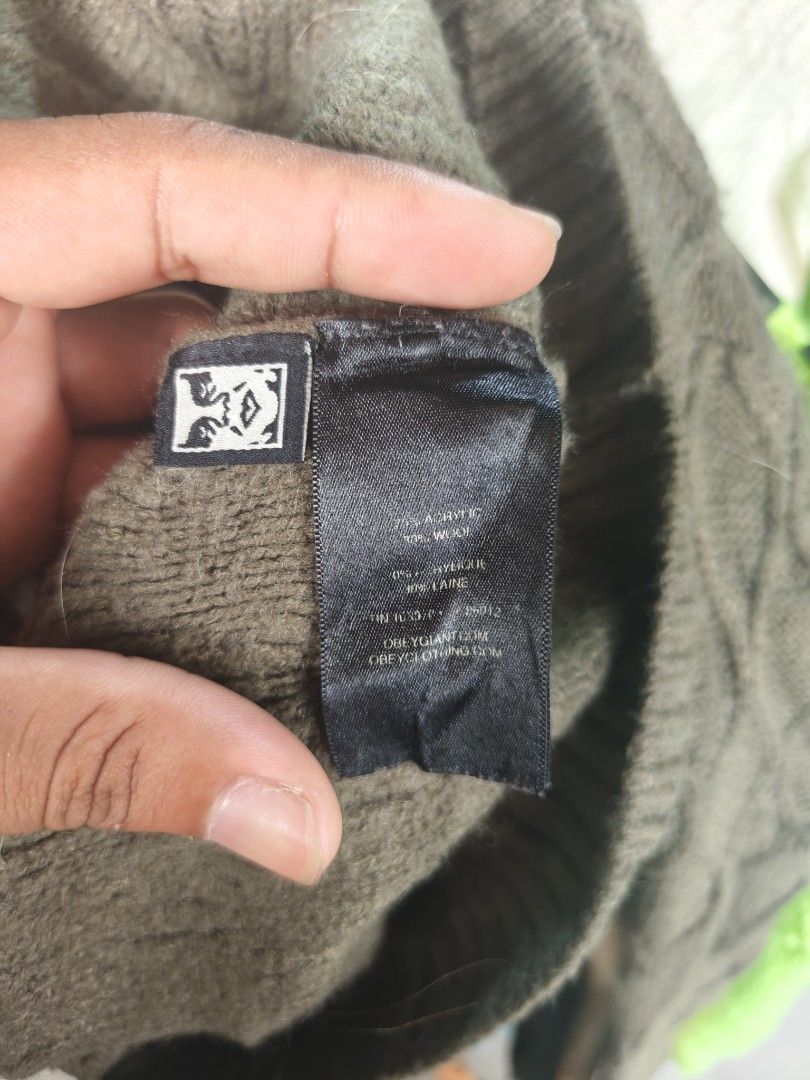 Obey Worldwide Green Cable Knit Sweater Size M (Category: Longsleeves) located in Isulan. Submitted by jaysthrift (Listing ID 1469753321, Image 3). Description: - Brand/Model: Obey Worldwide Sweater - Color: Army Green - Size: Medium (M) - Material: 90% Acrylic, 10% Wool (Made in China) - Design: Classic crewneck with textured cable knit pattern - Features: Thick, warm construction with ribbed collar, cuffs, and hem.