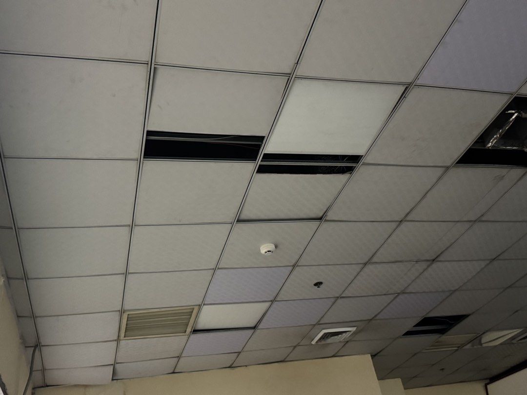 Office Suspended False Ceiling Panels Grids (Category: Construction & Building Materials) located in Manila. Submitted by marquezpa52205 (Listing ID 1469710442, Image 1). Description: - Used drop ceiling panels and metal grids from a commercial office - Standard square grid setup - Includes built-in air conditioning vents and a smoke detector - Note: Several tiles are missing, exposing the framework - Take-all or per-part options available - Self