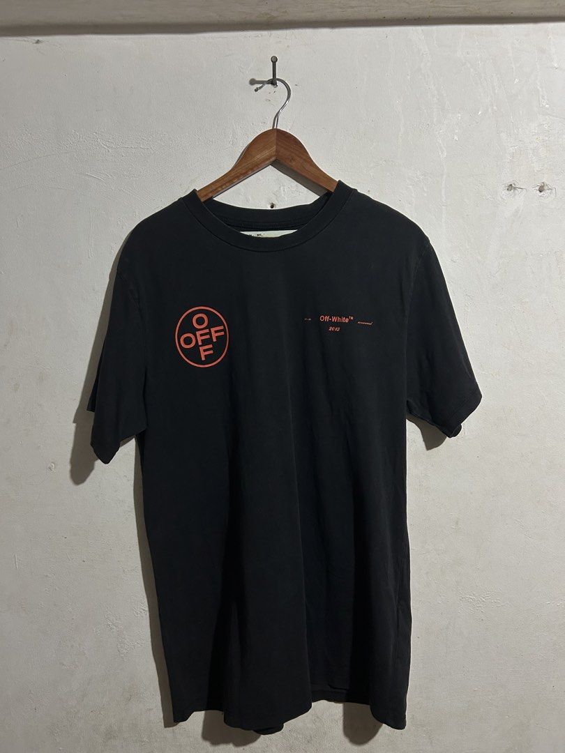 Off-White Gradient Arrows Black T-Shirt (Category: Tshirts & Polo Shirts ) located in Manila. Submitted by romnick907 (Listing ID 1469705790, Image 2). Description: - Authentic Off-White black tee from the Virgil Abloh era - Iconic gradient marker arrows graphic on the back - Circle Off-White logo and text branding on the front chest - Premium soft cotton material made in Portugal - Standard fit, clean condition with original neck and care tags i