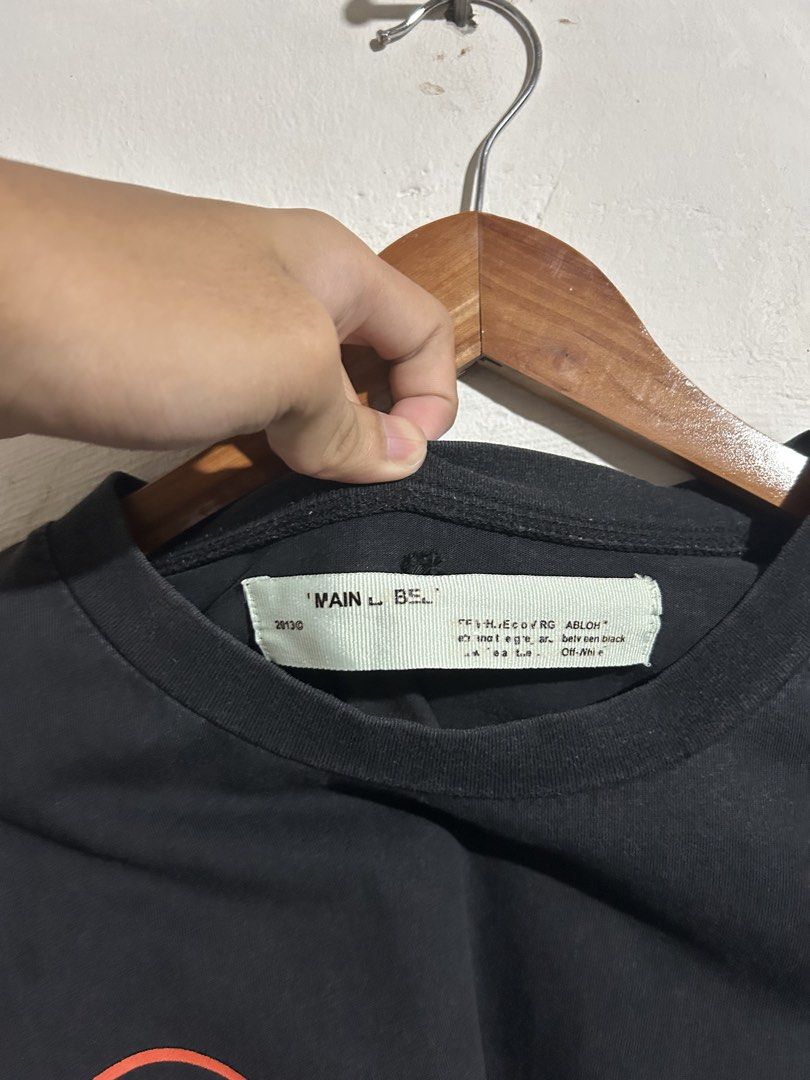 Off-White Gradient Arrows Black T-Shirt (Category: Tshirts & Polo Shirts ) located in Manila. Submitted by romnick907 (Listing ID 1469705790, Image 3). Description: - Authentic Off-White black tee from the Virgil Abloh era - Iconic gradient marker arrows graphic on the back - Circle Off-White logo and text branding on the front chest - Premium soft cotton material made in Portugal - Standard fit, clean condition with original neck and care tags i