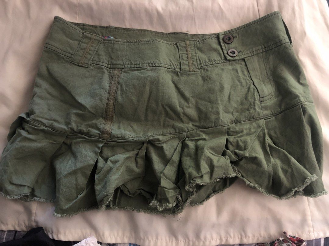 Olive Green Cargo Mini Skirt with Ruffled Hem (Category: Skirts) located in Manila. Submitted by seethestarrz (Listing ID 1469715969, Image 1). Description: - Color: Olive green - Style: Utility mini skirt, low-rise waistband with double button closure and belt loops - Details: Ruffled, distressed raw hem and front pocket accent waist line: 30-32 in but can be styled with a belt !! 📍qc, metro manila 🚚 jnt, sf shouldered by buyer.