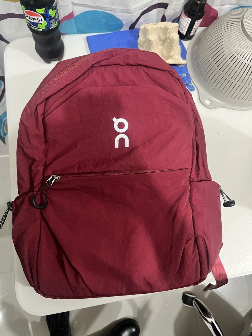 On Running backpack Burgundy (Category: Backpacks) located in Pasig City. Submitted by tabbies_tab (Listing ID 1469646398, Image 1). Description: On Running backpack Spacious main compartment good for laptops 15 inch, 2nd front compartment very spacious. Made in Vietnam. Rfs: not being used only in storage. .