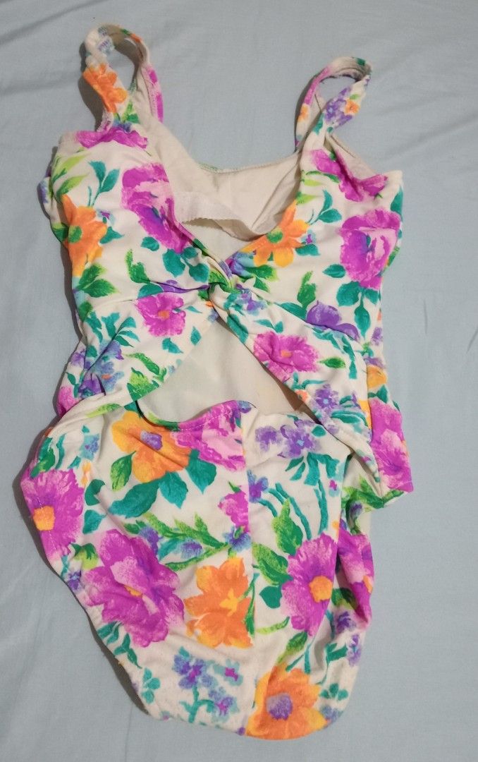One-Piece Swimsuit (Category: Bikinis & Swimsuits) located in Makati City. Submitted by YSL80022 (Listing ID 1469688482, Image 2). Description: - Brand: Lands' End - Style: One-piece swimsuit with scoop neckline and low-back twisted detail - Size: Women's Regular 6 - Origin: Made in USA - Material: 85% nylon, 15% Lycra spandex - Color/Pattern: Cream background with purple, orange, and green floral print - Features: Fully lined interior - Conditio