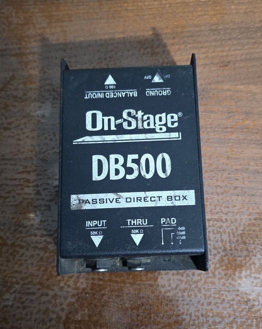 On-Stage DB500 Passive Direct Box // C09 (Category: Soundbars, Speakers & Amplifiers) located in San Juan City. Submitted by YardSaleSanJuan (Listing ID 1469707129, Image 1). Description: - Item: On-Stage DB500 Passive Direct Box - Function: Converts unbalanced instrument signals into balanced mic-level outputs - Features: 50k ohm input and thru jacks, XLR output, ground lift switch, and pad switch - Build: Heavy-duty metal chassis (shows normal 
