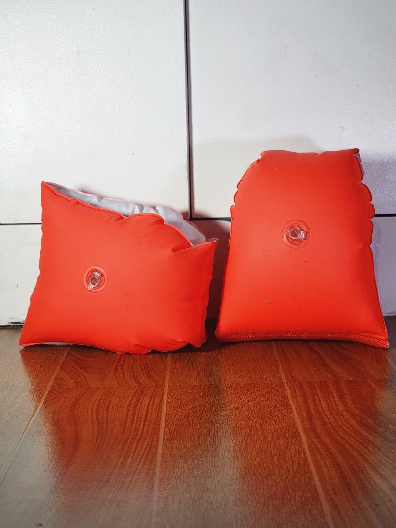 Orange Inflatable Swimming Arm Bands Floaties (Category: Water Sports) located in Meycauayan. Submitted by MP_Shop (Listing ID 1469587996, Image 1). Description: - Pair of orange inflatable arm bands for pool and beach use - Air valves are fully functional with no leaks - Shows normal signs of previous usage - Note: There is Japanese text written in permanent marker on one of the floaties - Affordable and ready for more fun in the water!.