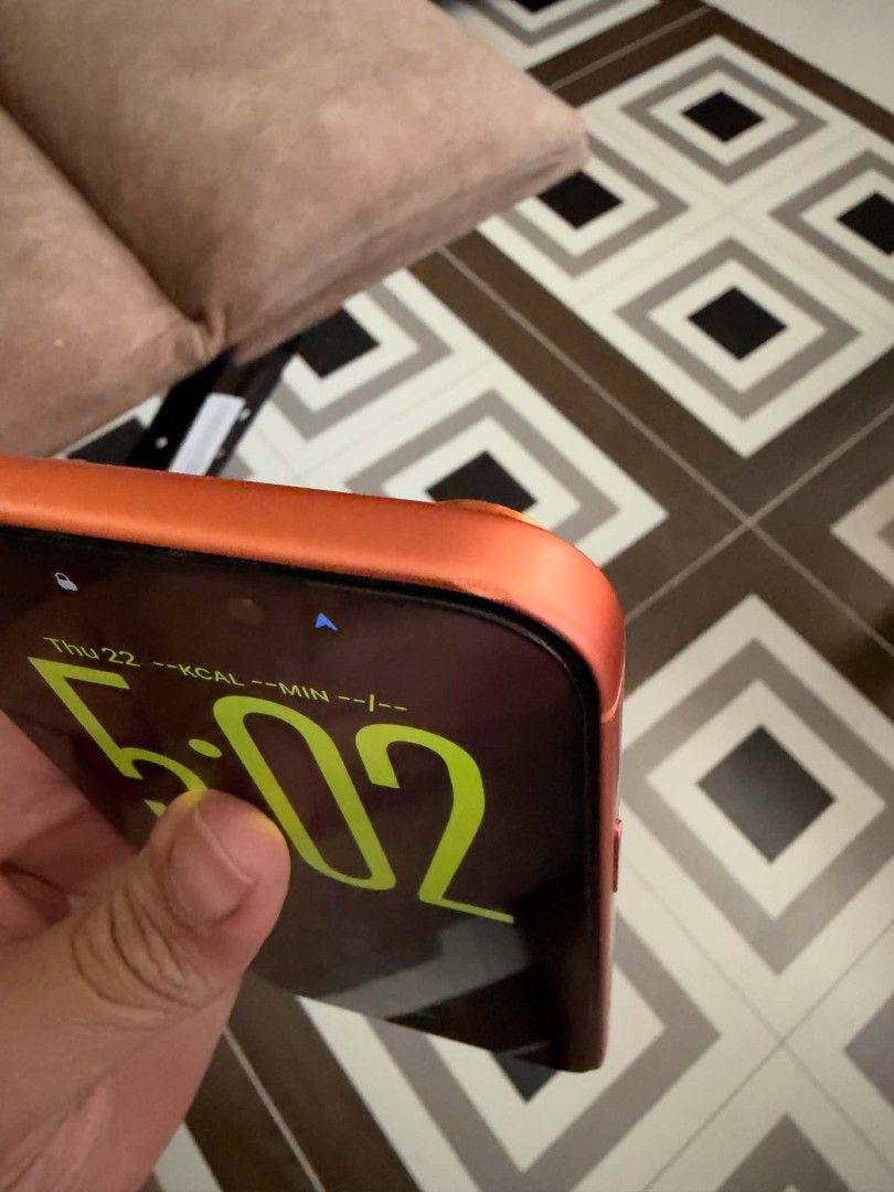 Orange iPhone with Casetify Cat Case (Category: iPhone 17 Series) located in General Trias. Submitted by curiouskid24 (Listing ID 1469687502, Image 3). Description: - Color: Bright Orange body with a custom wallpaper - Condition: Working great, minor dent on the top corner frame - Battery Health: 92% (469 cycle count) - Camera: Triple camera setup on the back - Inclusion: Bundled with a colorful Casetify case worth 4.5K featuring cartoon cat grap