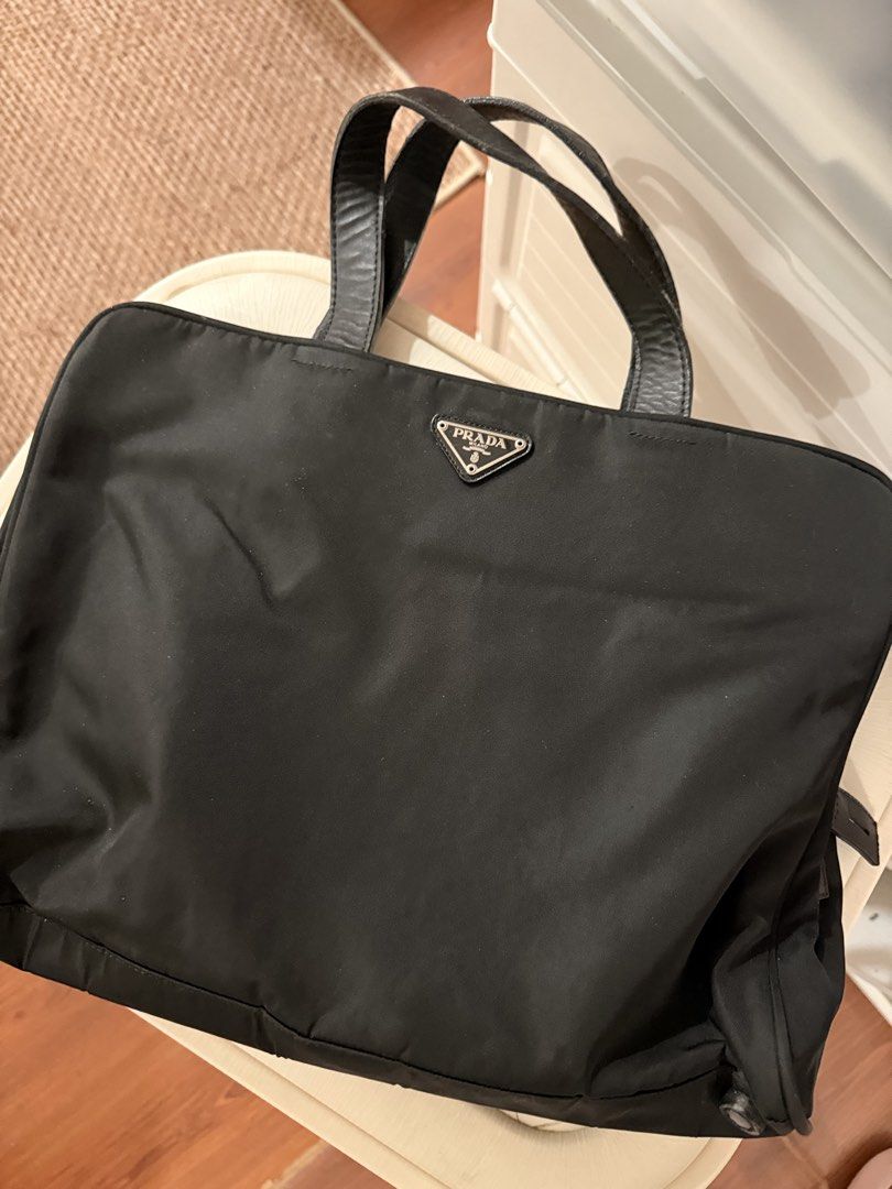 Original & Vintage Prada Nylon Laptop Bag (Category: Laptop Bags & Sleeves) located in Pasig City. Submitted by cosmic_ninisells (Listing ID 1469596651, Image 1). Description: 📌Item: Original & Vintage Prada Nylon Laptop Bag 📌 wear and tear on the leather handles but the bag itself is in great condition, see pictures! Can fit my MacBook Neo in the middle zipper compartment for reference. 📌Price: 2,500 negotiable! 📌 Return condition: Check ite